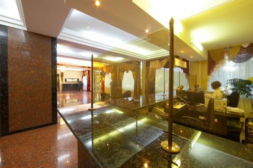 a lobby with a living room and a dining room at Dniprovski Zori in Kremenchuk