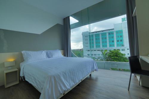 Cama o camas de una habitación en Ozone Hotel Pantai Indah Kapuk