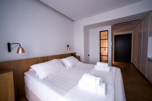 Ένα ή περισσότερα κρεβάτια σε δωμάτιο στο Sunday Boutique Hotel