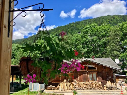 a house with purple flowers in front of it at Chalet Marmotte 1 in Morzine