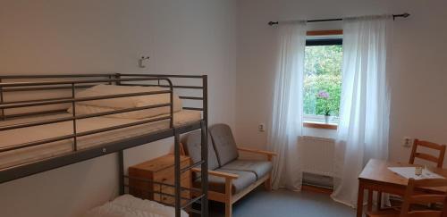 Postel nebo postele na pokoji v ubytování Torsby Vandrarhem