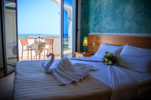 Postel nebo postele na pokoji v ubytování Abbaidda Hotel