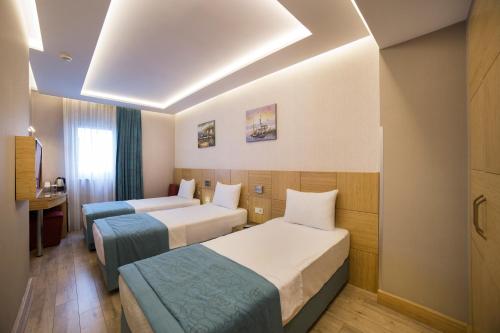 Katil atau katil-katil dalam bilik di Meretto Hotel LALELİ