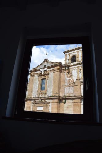 a view of a building from a window at Suite D'Autore Art Design Gallery in Piazza Armerina