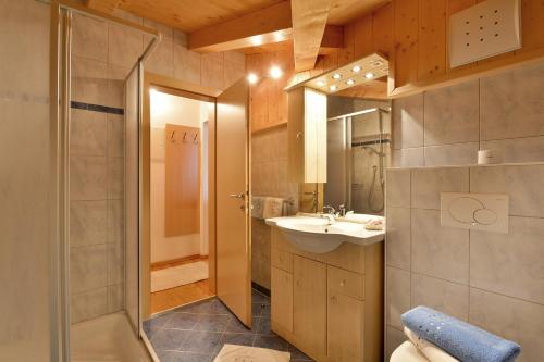 a bathroom with a sink and a shower at Appartments Antoniushof in Ellmau