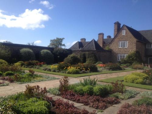 a garden in front of a house at Greywalls Hotel & Chez Roux in Gullane