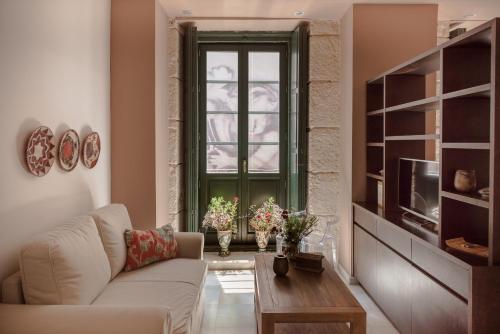 a living room with a couch and a window at Luces de Catedral in Alicante