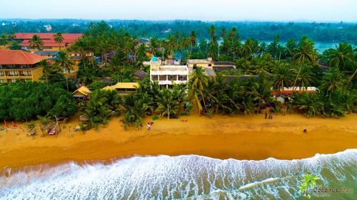 an aerial view of a beach in a resort at Hotel Coconut Bay in Kalutara