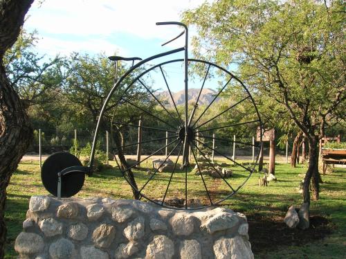 a large metal sculpture in a park at Posada Los Antiguos-Adults Only in Merlo
