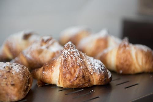 a group of pastries sitting on top of a table at Gasometer Urban Suites in Rome