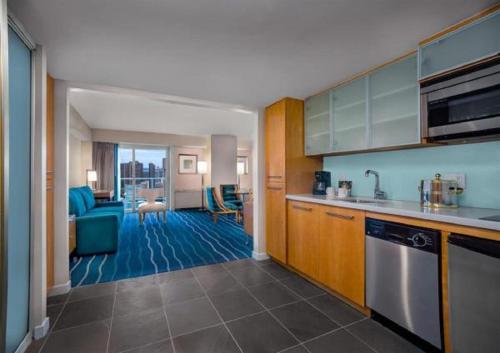 a room with a kitchen and a living room at Ala Moana Honolulu by Mantra in Honolulu
