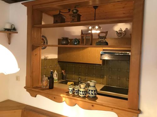 a kitchen with a counter with a sink at Stubalm Appartements in Salla