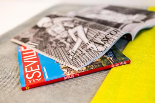 a magazine sitting on top of a table at La Puerta de Palacio - Adults Only in Seville