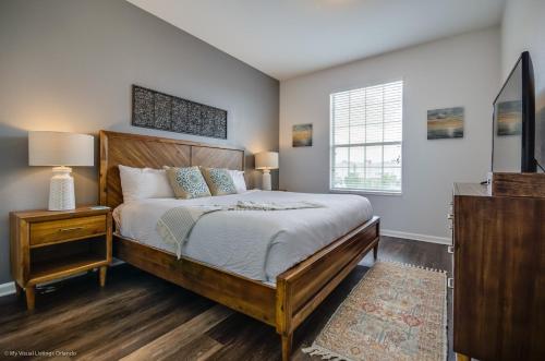 a bedroom with a large bed and a window at Orlando Escape in Orlando