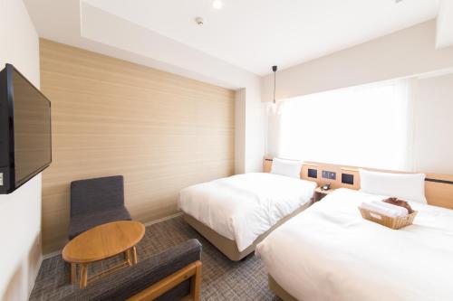 Postel nebo postele na pokoji v ubytování Hotel IL Verde Kyoto