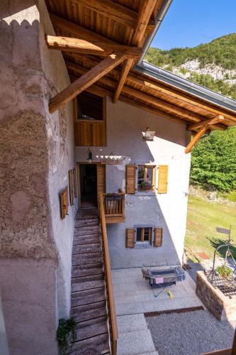 an outside view of a building with a porch at Limarò B&B in Sarche di Calavino