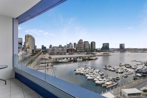 a view through a window of boats in the water at Docklands Private Collection - NEWQUAY in Melbourne