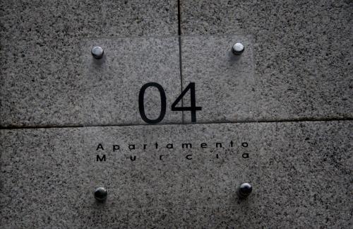 a sign on the side of a building at Apartamentos Rurales Las Vegas de Cardeo in Las Vegas De Cardeo