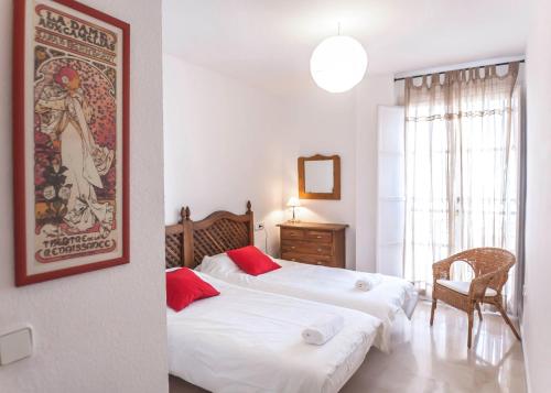 En eller flere senge i et værelse på Conde Ibarra Central