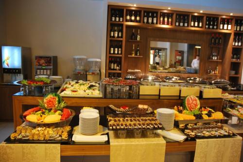 a buffet line with many different types of food at Hotel Jelena in Banja Luka
