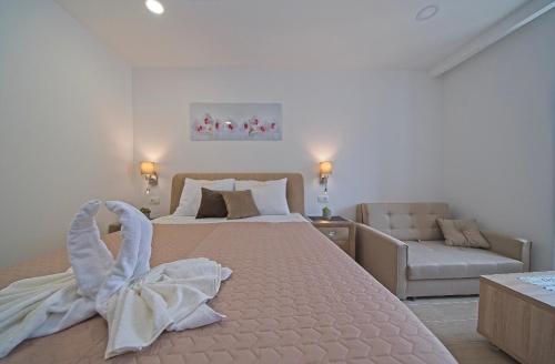 a bedroom with a bed with a towel on it at Villa Radić in Ston