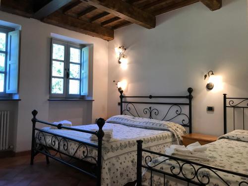 En eller flere senge i et værelse på Hotel Panoramico