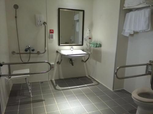 Kylpyhuone majoituspaikassa Dengfeng Milan Business Hotel