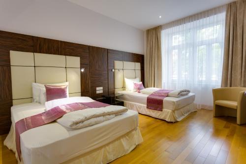 Postel nebo postele na pokoji v ubytování Best Western Plus Hotel Arcadia