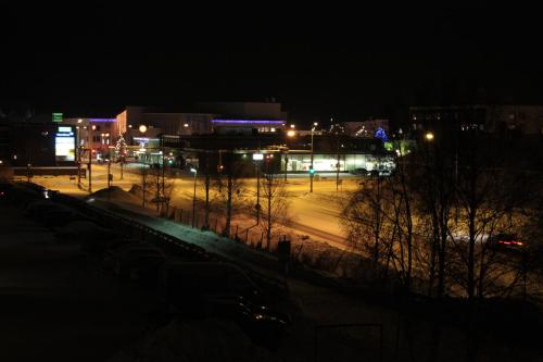 a city at night with street lights and buildings at Apartment Kirkkokatu in Raahe