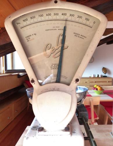 a toilet in a kitchen with a scale at Handia - Basquenjoy in Hondarribia