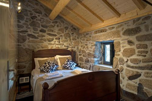 A bed or beds in a room at Casa Alagoa