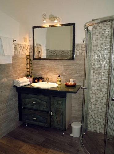 a bathroom with a sink and a shower at Villa Nada in Zadar