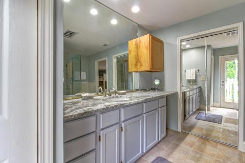 a bathroom with a sink and a mirror at Laurel Lodge at Mountain Cove in Fort Smith