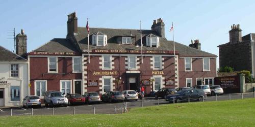 a large building with cars parked in front of it at The Anchorage Hotel in Troon