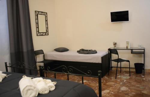 Postel nebo postele na pokoji v ubytování Mantegna Rooms