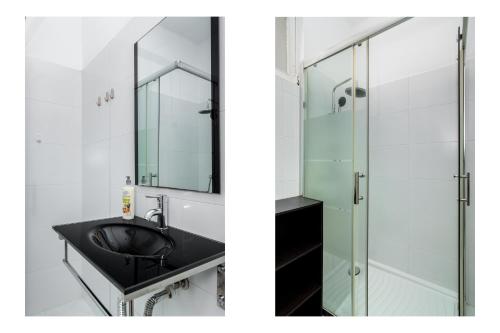 bagno con lavandino e doccia in vetro di WHome | Albufeira Suite & Beach Apartment ad Albufeira