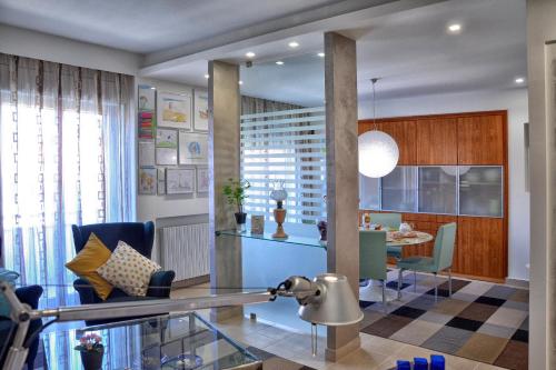 a living room with a table and a dining room at B&B Fossanoce in Belpasso