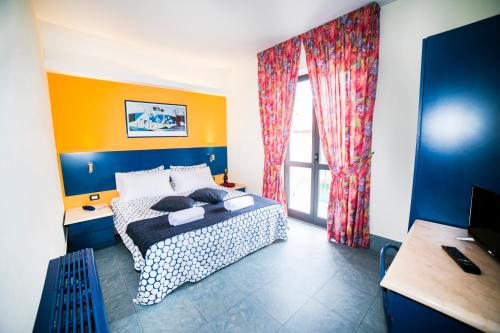 Postel nebo postele na pokoji v ubytování Hotel Raphael