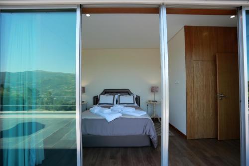 מיטה או מיטות בחדר ב-Quinta de Beiredos