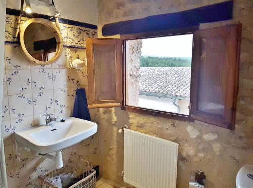 a bathroom with a sink and a window at Casas Benali in Benali