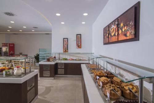 a bakery with a bunch of food on display at Belvedere Village in Agia Pelagia