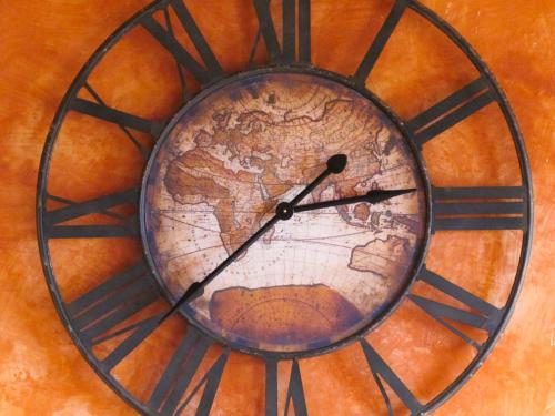 a clock with a map of the world on it at Oasi Galbusera Bianca in Rovagnate