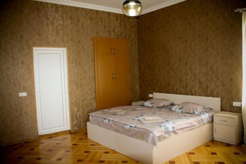 a bedroom with a bed and a door in it at Sighnaghi Inn in Sighnaghi