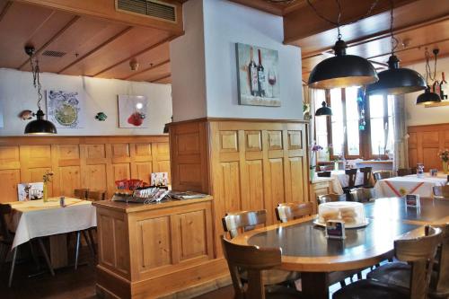 a dining room with a table and chairs in a restaurant at Hotel Gotthard in Brugg