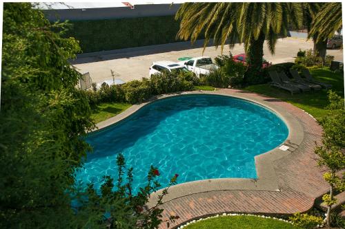 an overhead view of a blue swimming pool at Hotel Panamerican in Puebla