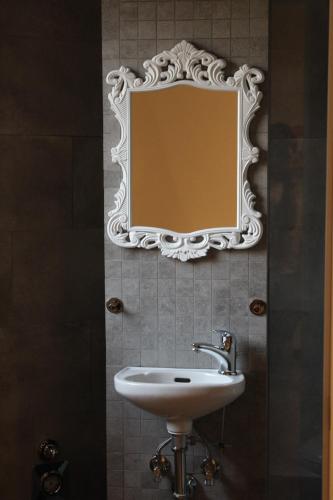 a bathroom with a sink and a mirror on the wall at B & B Da Matilde in Bologna