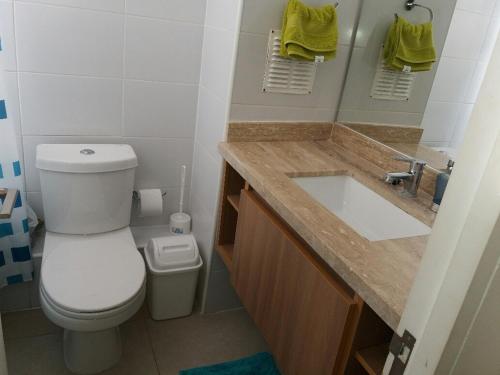 a bathroom with a toilet and a sink at Departamento en La Serena in La Serena
