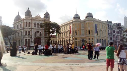 a group of people standing in front of a building at Mangue Oranje Hostel - no bairro do Recife Antigo - Old Town in Recife
