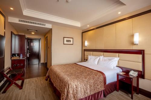 Letto o letti in una camera di Grand Hill Hotel Ulaanbaatar