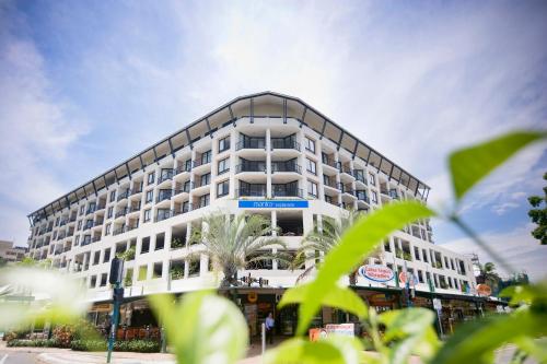 a large white building with a lot of windows at Mantra Esplanade in Cairns